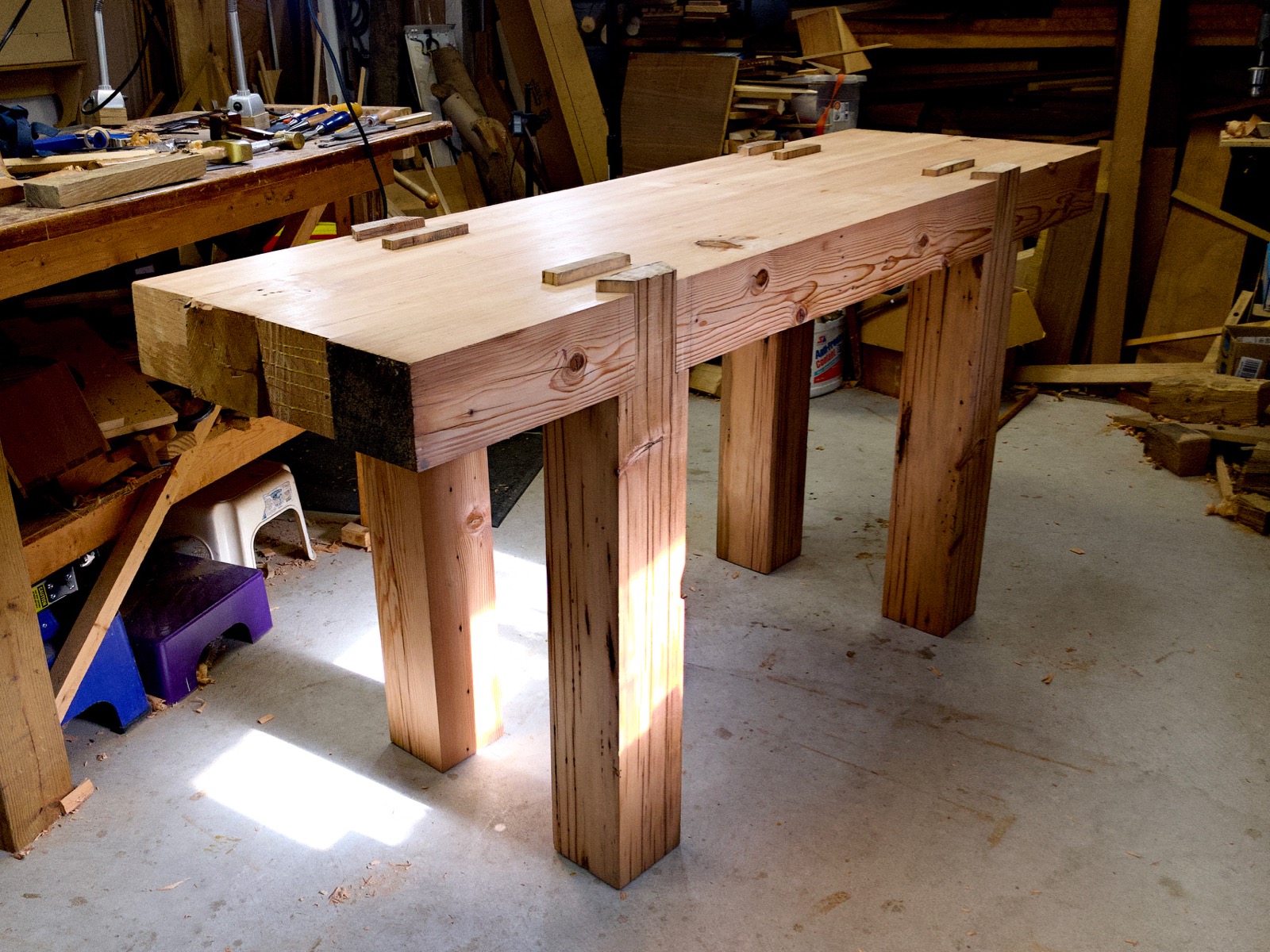 The bench sitting upright on its legs for the first time.
